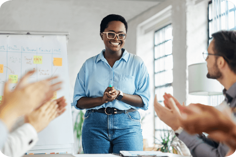 woman presenting and smiling